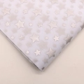 Detail showing white tissue paper with silver star patterns for flower wrapping - Silver Star