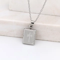 Silver book locket necklace with cross design on decorative stone display - Cross Square/Steel