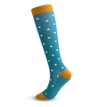 Cyan compression socks with white polka dots and orange heels in a studio shot - Blue White Dots