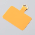 Detailed view of yellow TPU phone lanyard tab with a durable golden metal D-ring attachment - Gold Buckle / Orange