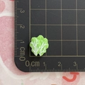 Detailed view of a 1cm miniature green resin lettuce leaf on a scaled cutting mat - Two Green Leaves