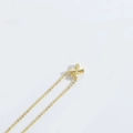 Minimalist gold necklace with a small X-shaped cross pendant on a fine link chain - Letter X