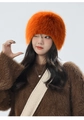 Detail of bright orange plush trapper hat showing soft faux fur texture for winter - One Size / Orange