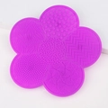 Purple flower-shaped silicone makeup brush cleaning mat with various functional textures - Deep purple