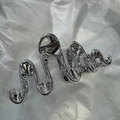 Silver liquid metal claw clip with a fluid wave design and polished glossy finish - Irregular Wave Silver 13cm