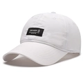 Breathable white quick-dry baseball cap with black woven logo patch in a side view - Non-perforated Style / White