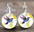 Macro view of French hook earrings with colorful hummingbird art under glass dome - Style 3