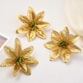 Three golden artificial velvet Christmas flowers on a white background for tree decor - Gold