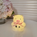 Cute glowing cow night light made of soft vinyl with a pink checkered ribbon bow - Cow - Pink