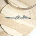 Silver metal hair clip featuring Smile text and heart charm on a wooden tray - Silver Letter