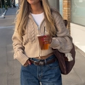 Minimalist beige cable knit cardigan sweater with zipper closure shown on urban street - S / Camel