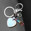 White heart-shaped crystal keychain with seven chakra beads and silver metal clip - Opal (Multi-Color Chakra Beads)