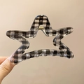 Detail of star-shaped hair claw clip with classic black and white gingham grid pattern - Black Checkered Star Claw