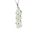 Macro view of a light green crystal hexagonal pendant with silver spiral wire wrap - Silver+Aventurine