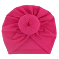 Close-up of baby donut turban hat in rose red soft fabric with detailed donut knot - One Size / Rose Red