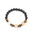 Macro detail of natural tiger eye, volcanic lava, and faceted crystal beaded bracelet - Citrine