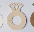 Close-up of laser-cut diamond-style place cards in pink and beige textured paper - Jade Pearl