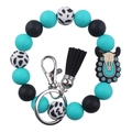 Detail of beaded silicone wristlet keychain with black tassel and cow skull charm - Bull Skull