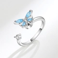Adjustable silver butterfly spinning ring featuring blue crystals and a round clear stone - AJ101 Silver Blue Zirconia