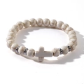 Detailed view of white turquoise beads and cross pendant on an elastic beaded bracelet - White (Turquoise Texture)