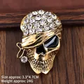 Golden pirate skull brooch with clear rhinestones and black enamel eye patch - Antique Gold Rhinestone Skull (XZ25142)