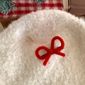 Detailed view of red plush bow hair clip on a white fleece beret for festive outfits - Single Duckbill Clip Style / Red