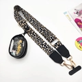 Detail of adjustable leopard print strap with a clear PVC mini pouch and golden hooks - Leopard Print Strap With Pouch And Tab