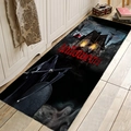 Macro shot of Halloween runner rug featuring reaper, ghost and haunted house on black flannel - 40x60cm / Grim Reaper & Skull