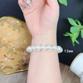 Close-up of 12mm white pearl bracelet worn on wrist with vintage French style design - 12mm Pearl Bracelet
