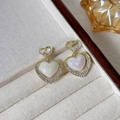Golden double heart earrings with pearl inlay and crystals on jewelry tray - 40# Micro-painted Heart-shaped Pearl Earrings