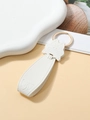 Detail of white PU leather keychain with cute cat head design and gold metal ring closure - White