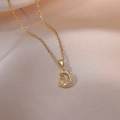 Elegant gold celestial necklace featuring a crescent moon and star pendant with zircons - Star Moon Necklace (X0151) / Gold