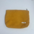 Detail of yellow corduroy makeup bag showing ribbed texture and May Rabbit brand label - Ginger Yellow