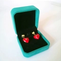 Red heart-shaped stud earrings with gold star accents in a green velvet jewelry box - 7x7 Medium Pendant Box / Emerald Green Black Inner