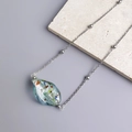 Detail of colorful waterdrop glass pendant with gold leaf foil on beaded chain - Steel-Light Blue