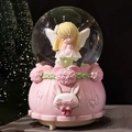 Pink musical snow globe with golden-haired angel and rabbit on floral embossed base - 2514 Pink Base / Medium 80mm Light + Music