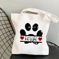 White canvas shoulder bag featuring black Beagle dog paw prints and red heart graphics - Beagle Paw Prints