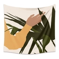 Detail view showing fine woven texture and abstract hand leaf pattern on bohemian tapestry - Monstera Leaf