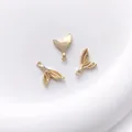 Detailed view of three 14K gold plated whale tail charms for DIY jewelry making and crafts - 5# Fish Tail 9x14.5mm