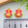 Pair of red enamel fortune bag charms with gold finish and ruler for size comparison - Wealth Treasure Money Bag (19x15mm)