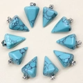 Top view of ten turquoise-style hexagonal crystal pendants arranged in a neat circle - Turquoise