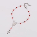 Detail of red beaded rosary bracelet with silver crucifix and holy medal pendant - Red