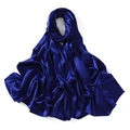 Detail showing smooth silky texture and soft folds of the dark blue satin long scarf - Klein Blue