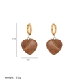 Detail of heart-shaped stone earrings in gold finish with precise size and weight dimensions - A2-07-Earrings (Brown)