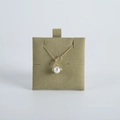 Detail of a pearl pendant necklace with V-shaped zircon clasp on a green velvet display board - 6*6cm / Army Green