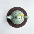 Pale green ice-cracked glaze ceramic teapot with a dark brown bamboo woven coaster - Coffee Round 15cm