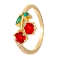 Detail of gold cherry ring with red and green cubic zirconia stones and side pavé - Adjustable Open / Gold Cherry Leaf Style