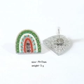 Detailed view of rainbow hoop earrings with HO HO HO text and silver glitter back - Rainbow