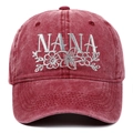 Detailed embroidery of silver NANA letters and floral vines on a washed burgundy baseball cap - Adjustable / Burgundy