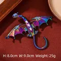 Iridescent dragon brooch with white rhinestones on reddish brown textured fabric - Iridescent Multi-Color Dragon